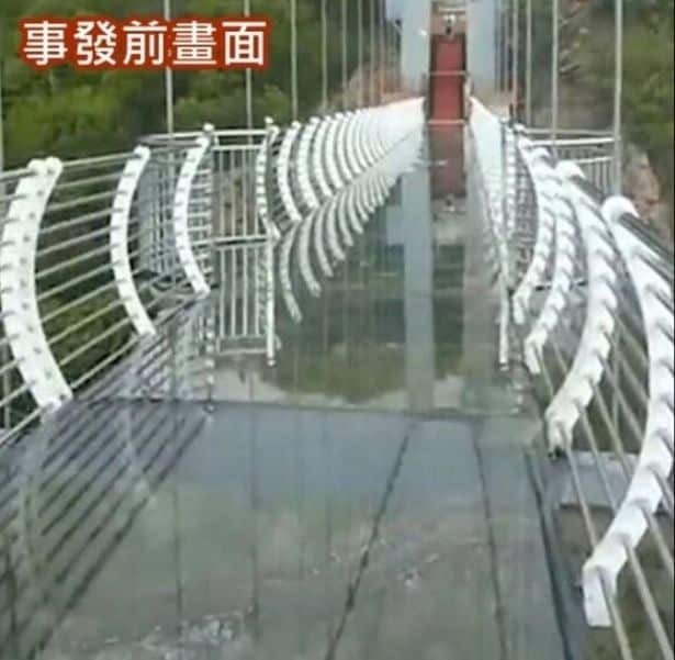 Tourist in China left hanging from 330 ft high glass bridge as wind blows away its panels 1